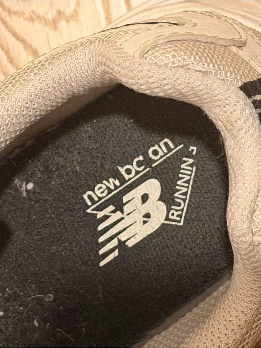 New Balance Cream Sneakers with Black Logo